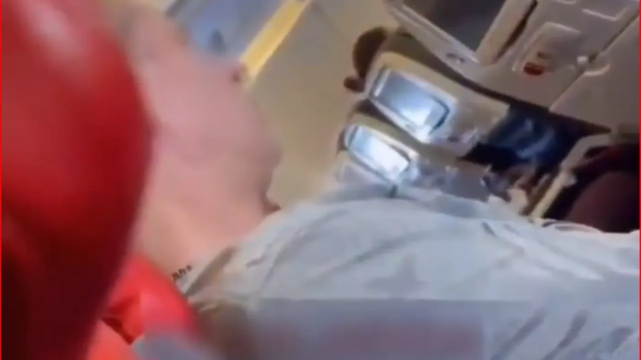 Watch: Man caught urinating on plane floor from seat